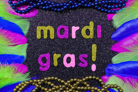 Mardi Gras Text With Bead Strings And Feathers Layoutの写真素材