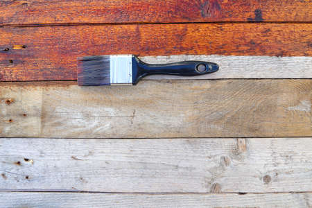 Rustic Wood Surface Restoration Coating With Paintbrush Flat-layの写真素材