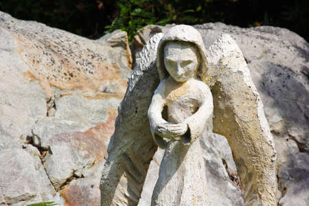 Cradling Angel Garden Ornament Cement Sculptureの写真素材