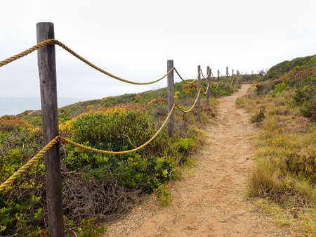 Coastal Gravel Hiking Trail With Rope Handrailの写真素材