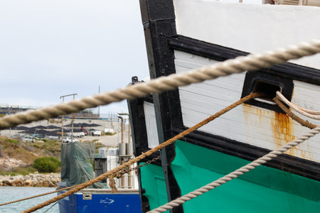 Fishing Vessels With Mooring Lines Tied In Harbor