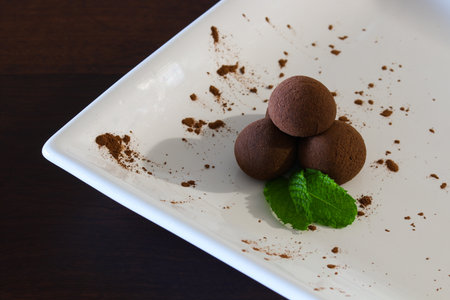 Traditional Brazilian Chocolate Cacao Brigadeiro Balls With Mint Leavesの写真素材