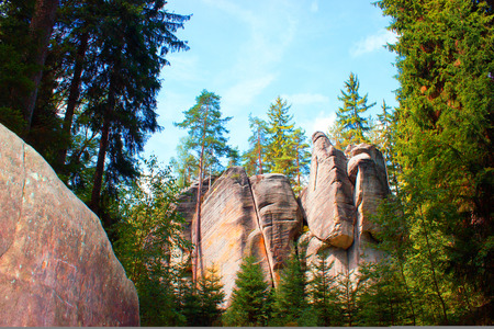 Right rock  is like the sculptures and in the background is the rock with trees.の写真素材