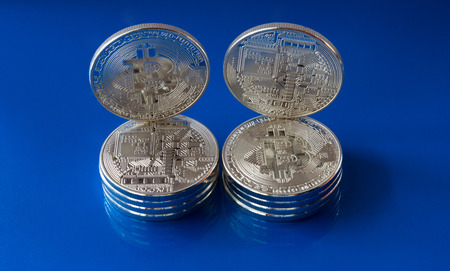 On a blue background are coins - It's the back and face of the coin of a fictitious crypto currency...