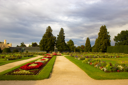 Chateau park Lednice with flowers and trees. On the left is Lednice castle.のeditorial素材