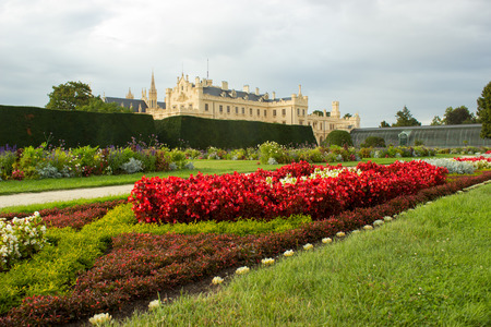 Chateau park Lednice with flowers and trees. On the left is Lednice castle.のeditorial素材