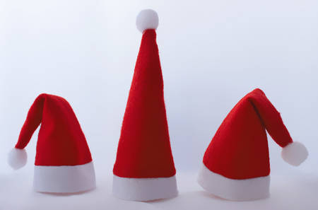 Christmas three caps from Santa Claus on grey background.の写真素材