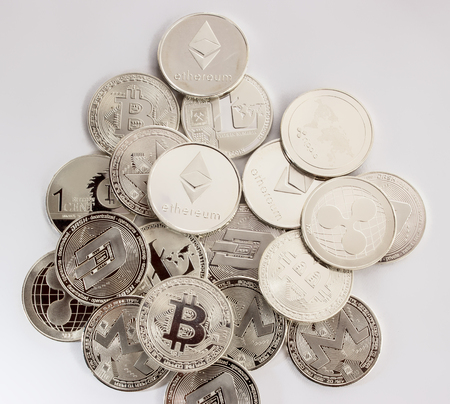 Silver coins of a digital crypto currency - litecoin bitcoin ethereum monero ripple dashの写真素材