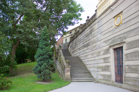 Old castle stairs, path, door in the wall, and treesのeditorial素材