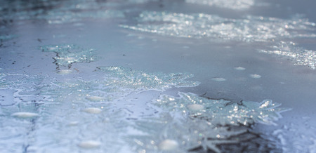 Frozen water on the window creates silver beautiful decoration ornaments.の写真素材