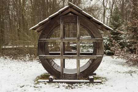 Exposed wooden water mill impeller with canopy in winter in Roznov pod Radhostem in Czech republicの写真素材