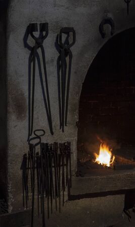 The old tools in the blacksmith's shop. Fire forge in the smithy.の写真素材