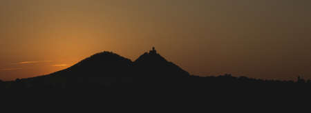 Sunrise and view of the silhouette of the castle Bezdez in the czech republicの写真素材