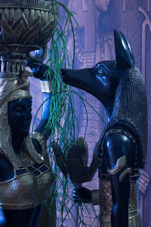 Still life of statues of mythology jackal anubis inpu anup and Cleopatra's Nubian servant with a...