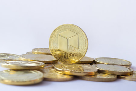 Neo coin stand on other cryptocurrencies. Pale blue background.