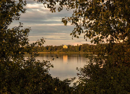 Temple of Apollo at sunset with reflection on the surface of the pond. It is listed as a UNESCO World Heritage Site.のeditorial素材