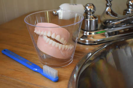 Dentures by a sinkの写真素材