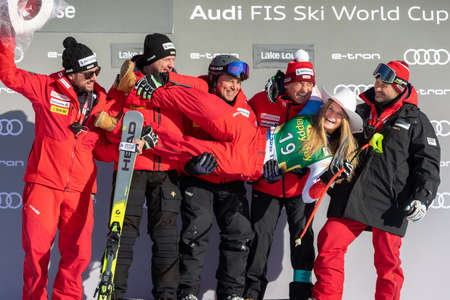 Corinne Suter of Switzerland celebrates with her team third place at FIS Ski World Cup Super-G in Lake Louise, Alberta, Canada, December 08, 2019.のeditorial素材