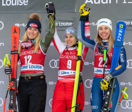 Mikaela Shiffrin of the United States, Nicole Schmidhofer of Austria and Francesca Marsaglia of Italy at the Women's World Cup Alpine Downhill Race in Lake Louise, Alberta, Canada, December 07, 2019のeditorial素材
