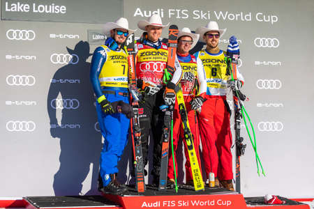 Lake Louise/Canada - November30, 2019: FIS Alpine Skiing World Cup. (L-R) Dominik Paris (2nd place) Thomas Dressen of Germany (1st place) Beat Feuz and Carlo Janka(R) of Switzerland (3rd)のeditorial素材