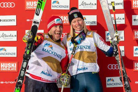 Kevin Drury of Canada and Sandra Naeslund of Sweden at the Audi FIS Ski Cross World Cup Race in Nakiska, Alberta, Canada, January 18, 2020.のeditorial素材