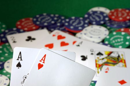 Two aces with their two ace friends in the background on a pot they just won...