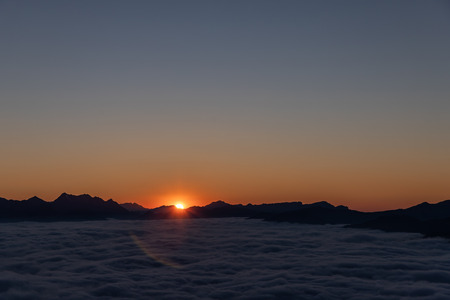 Sunset over clouds
