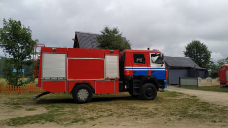 red and white fire truck in the village.