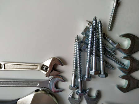 layout of tools for plumbing repairs on a white background. Vertical photo