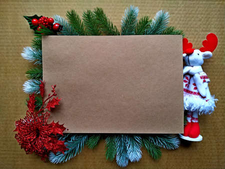 christmas background for postcard. Craft paper on fir branches with elements of Christmas decor