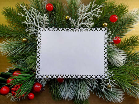 christmas background for postcard. fir branches with elements of Christmas decor on red linen burlap