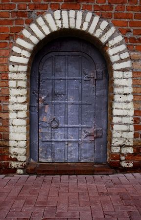 Metal door in the wallの写真素材