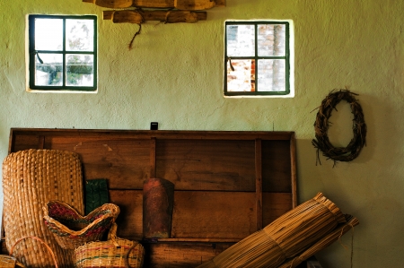 An interior shot of a colonial with wicker baskets and other decoration の写真素材
