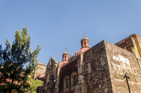 A red old brick church in the center of Mexico Cityの写真素材