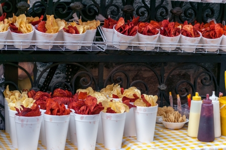 Red and yellow potato chips being sold from a stall in Mexico Cityの写真素材