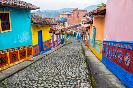 Colorful colonial houses on a cobblestone street in Guatape, Antioquia in Colombiaの写真素材