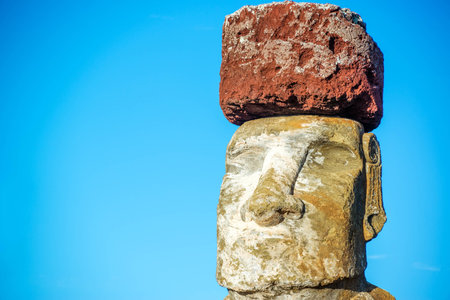Closeup of a Moai on Easter Island wearing a pukao, or topknotの写真素材