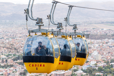 COCHABAMBA, BOLIVIA - AUGUST 8: A cable car takes passengers up to the Cristo de la Concordia statue in Cochabamba, Bolivia on August 8, 2014のeditorial素材