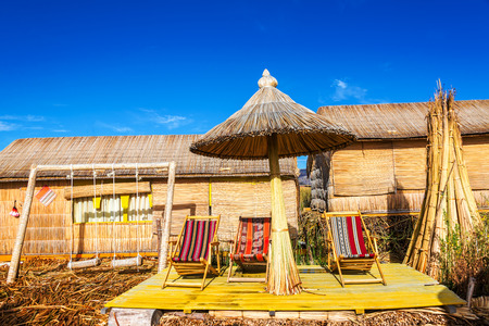 Chairs and a swing set on Uros floating islands near Puno, Peruのeditorial素材