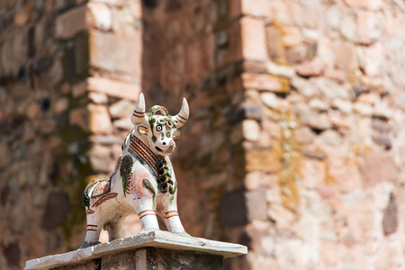 Small bull figurine on a church in Pucara, Peru near Cusco.  The bull is believed to protect buildings.の写真素材