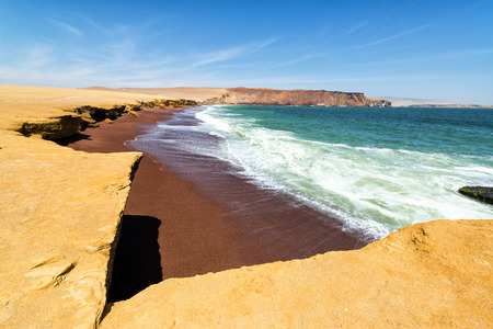 Red sandy beach called Playa Colorada near Paracas, Peruの写真素材