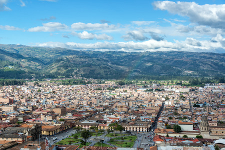 Cityscape view of Cajamarca, Peru and the surrounding hills with the Plaza de Armas visible at the...