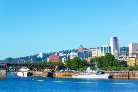 PORTLAND OR  JUNE 7: Navy and Coast Guard ships on the waterfront of Portland Oregon during the Rose Festival on June 7 2015