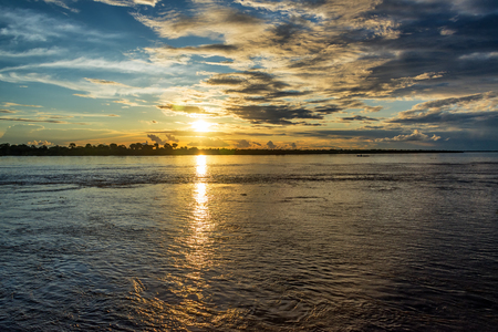 Sunset over the Amazon river near Leticia, Colombiaの写真素材