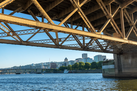 View of downtown Portland, Oregon as seen from under the Morrison Bridgeの写真素材