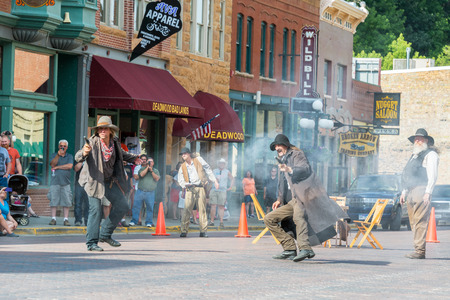 DEADWOOD, SD - AUGUST 26: Actors reenact a historic gunfight in Deadwood, SD on August 26, 2015のeditorial素材