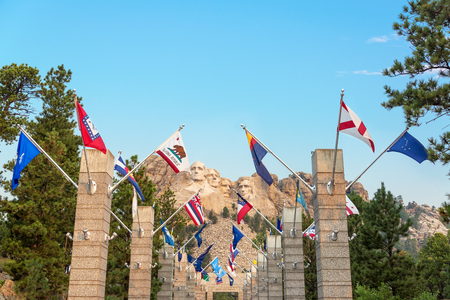 Row of state flags leading to Mount Rushmore in Keystone, South Dakotaのeditorial素材