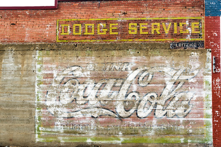 RED LODGE, MT - SEPTEMBER 8: Weathered Coca Cola sign on an old brick wall in Red Lodge, MT on September 8, 2015のeditorial素材