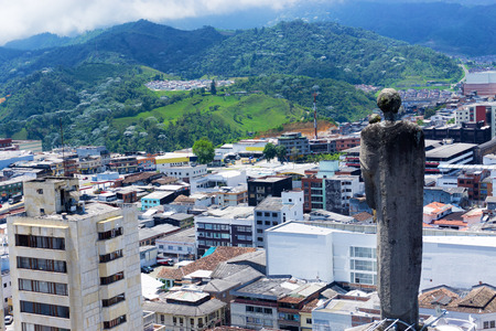 Statue on the basilica overlooking the city of Manizales, Colombiaのeditorial素材