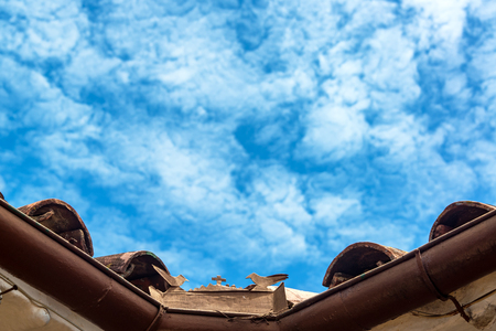 Small cross and birds with a beautiful blue sky in Barichara, Colombiaの写真素材
